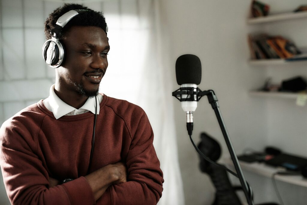 a voice actor performing in front of a microphone