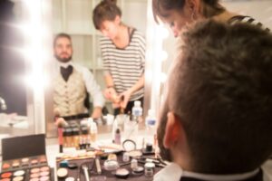 an actor in their dressing room preparing